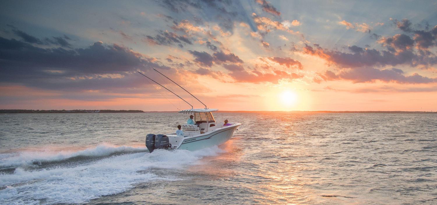 Fishing boating cruising into the sunset
