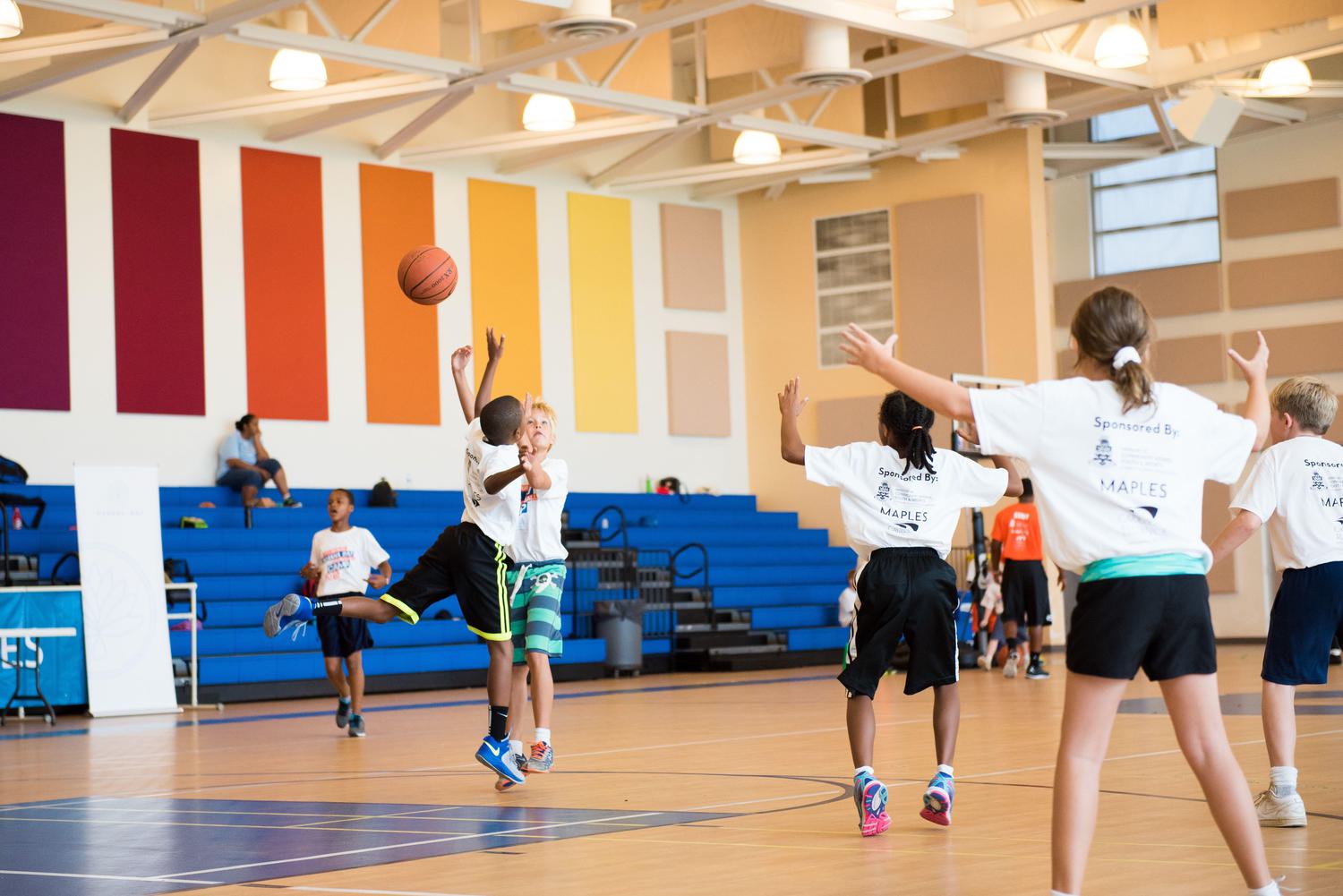 Kids playing basketball in the community centre