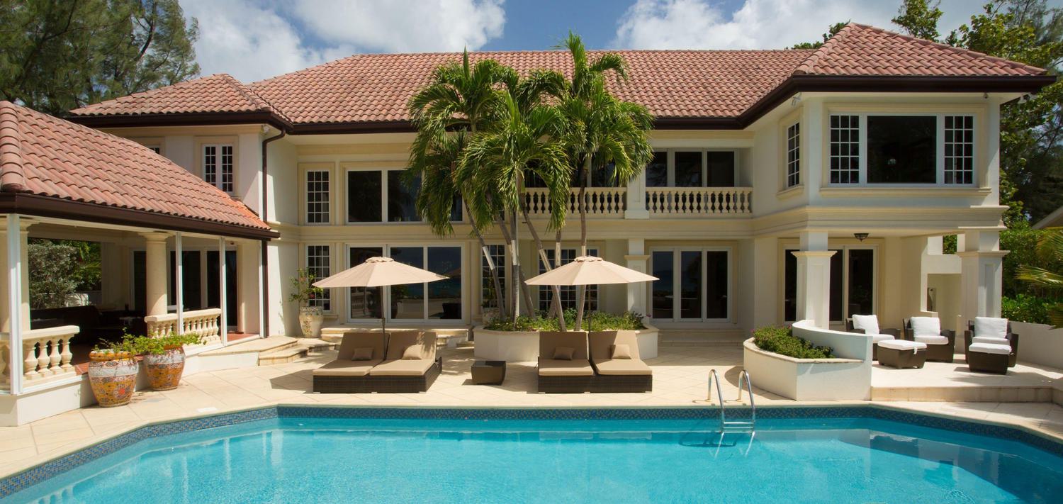 View of a private pool and cabana at a beautiful two story luxury home