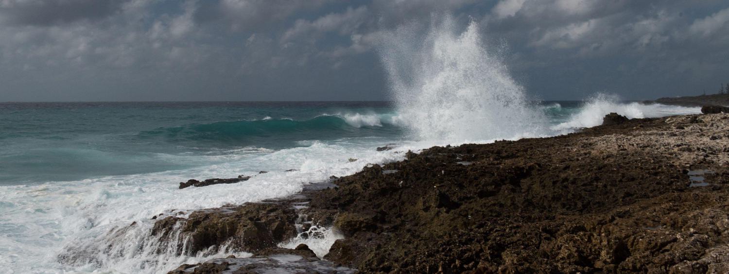 Waves crashing against rocks in the Cayman Islands