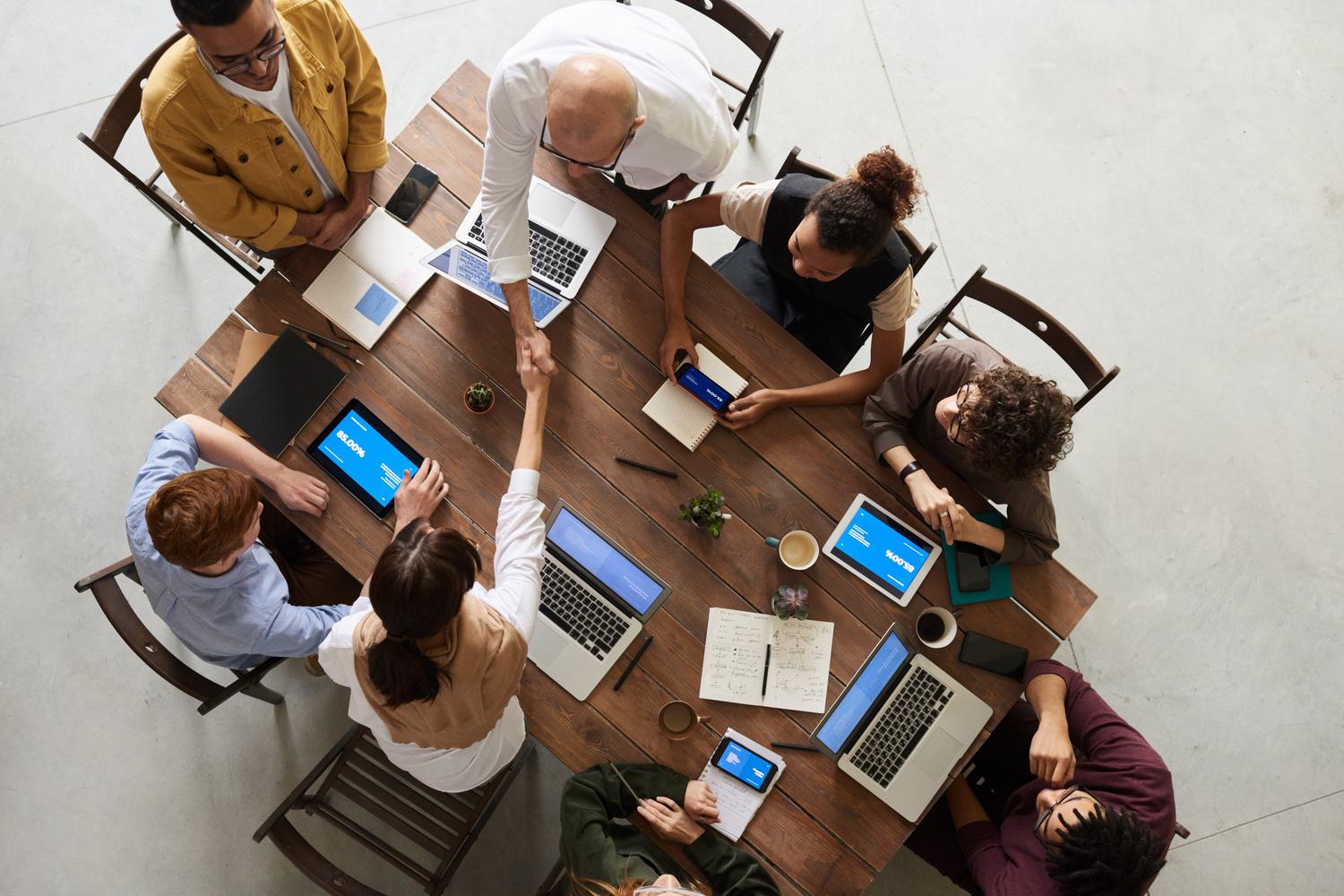 Aerial photo of business people giving handshakes