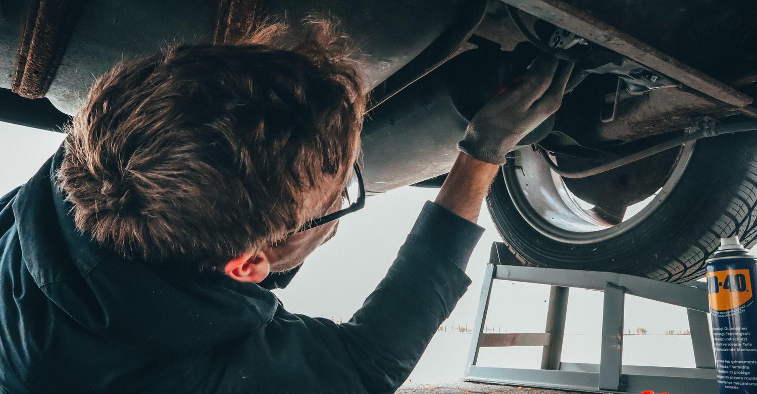Man fixing vehicle engine