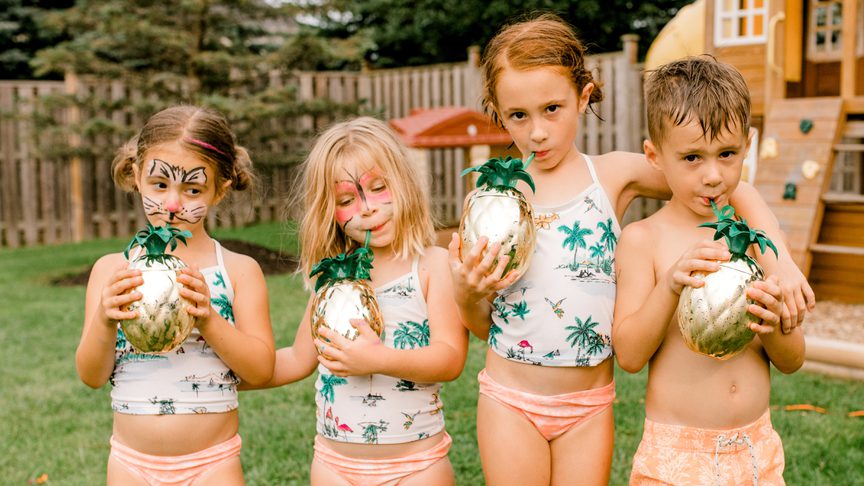 3 girls and a boy enjoying a birthday party in with face paint