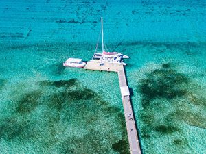 Aerial view of boat docked at a pier in the Cayman Islands