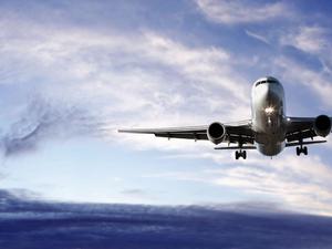 Airplane flying across the sky