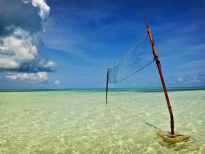 Beach volleyball net placed in the ocean