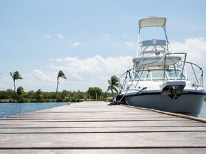 Boat docked on wooden pier in the Cayman Islands