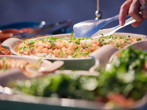 Close up of scooping food out of a dish