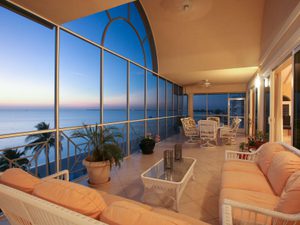 Enclosed patio overlooking the ocean at sunset