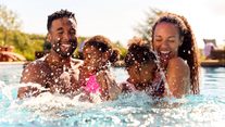 Family in swimming pool