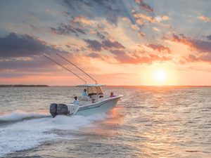 Fishing boating cruising into the sunset
