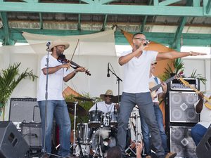 Group of Caymanian musicians on stage performing