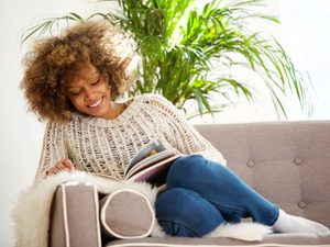 Lady reading on the sofa