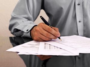 Man auditing financial statements