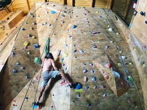 Person indoor rock climbing