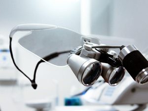 Person showing optometrist magnifying glass