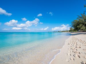 Seven mile beach blue and footprints