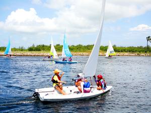 Several sailing boats in the waters of the Cayman Islands