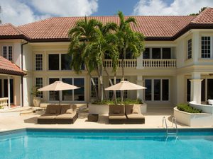 View of a private pool and cabana at a beautiful two story luxury home
