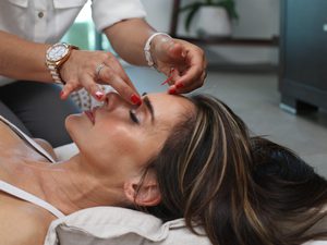 Beutiful brunette woman side profile getting anti aging treatment
