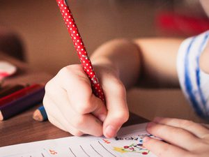 Close up of girl writing
