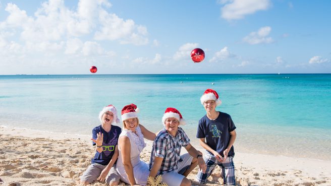 Family enjoying christmas on the beach in cayman