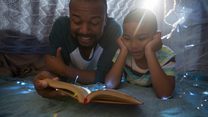 Father and son reading