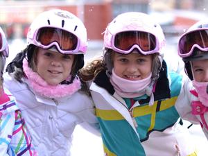 Four little girls enjoying a ski holiday