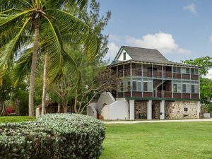 Green lawns of pedro st james and palm trees
