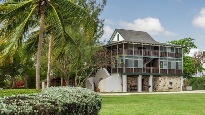 Green lawns of pedro st james and palm trees