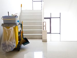 Janitorial tools in office building stairwell