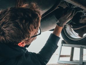 Man fixing vehicle engine
