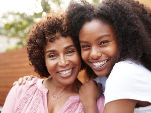 Mum and daughter smiling