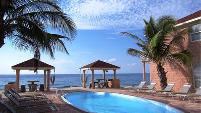 Ocean view of pool and cabanas at resort