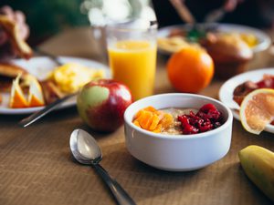 Shallow focus photo of spoon at nutritious healthy breakfast