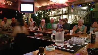 View of busy bar at the captains table restaurant
